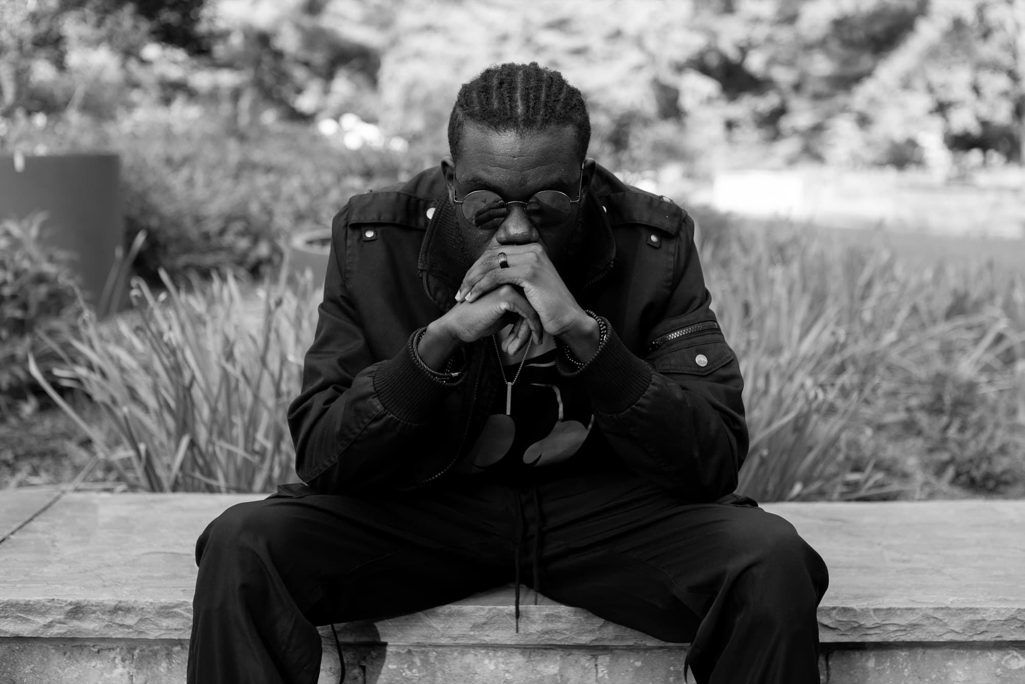 Kweku Diaw seated outdoors